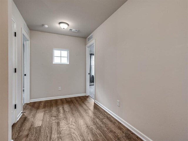 915 Kings Canyon Rd, Norman, OK 73071 - unfurnished room with wood finished floors and baseboards