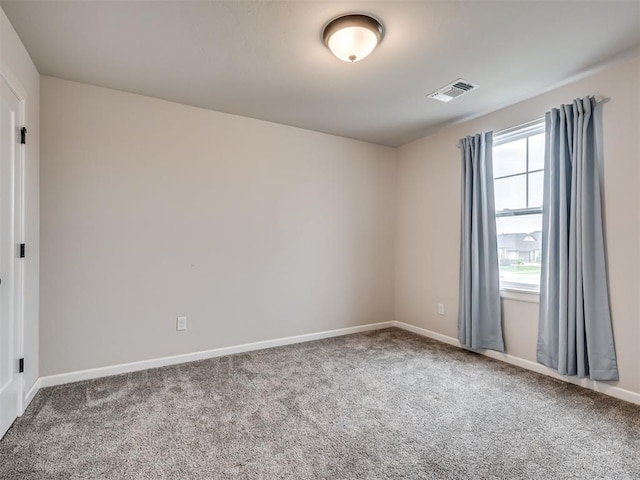 915 Kings Canyon Rd, Norman, OK 73071 - spare room featuring carpet and baseboards