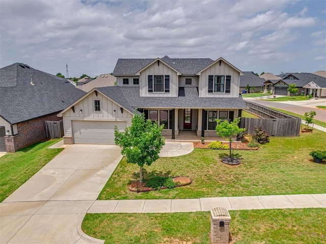 915 Kings Canyon Rd, Norman, OK 73071 - view of front of home featuring board and batten siding, covered porch, concrete driveway, an attached garage, and roof with shingles