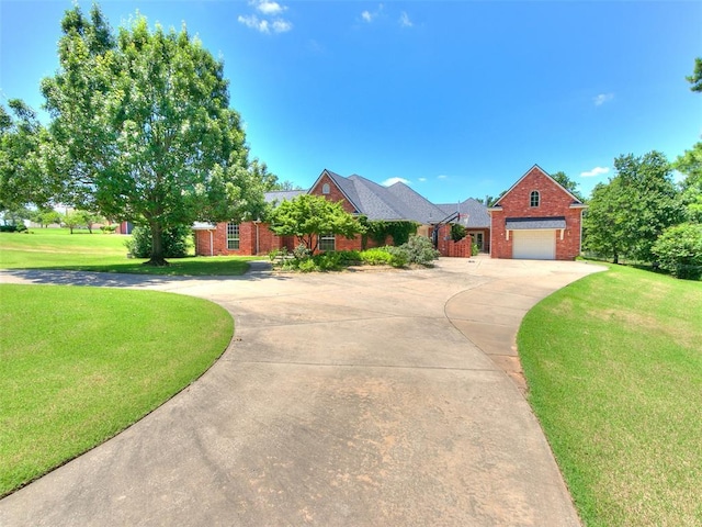 1031 Hidden Valley Ln, Choctaw, OK 73020 - view of front facade featuring concrete driveway, brick siding, a front lawn, and a garage