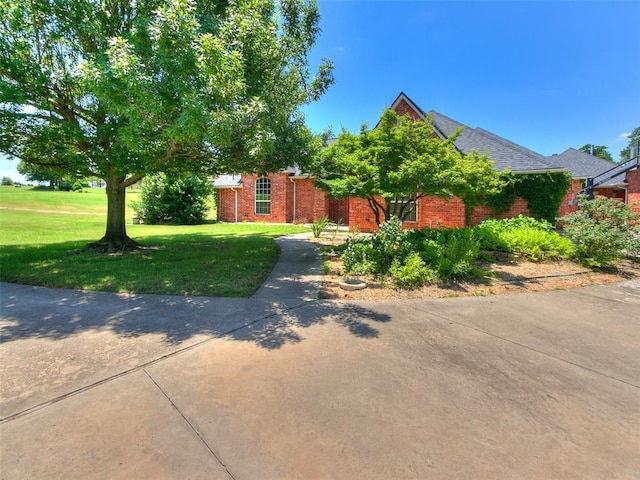 1031 Hidden Valley Ln, Choctaw, OK 73020 - view of front of home with a front lawn and brick siding