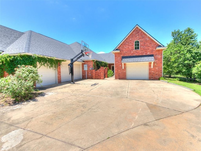 1031 Hidden Valley Ln, Choctaw, OK 73020 - view of front facade with brick siding, a garage, and concrete driveway