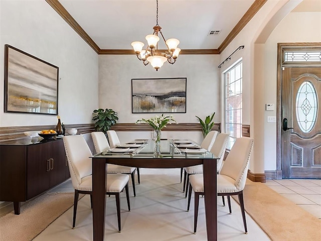 1031 Hidden Valley Ln, Choctaw, OK 73020 - dining space with a chandelier, crown molding, plenty of natural light, and arched walkways