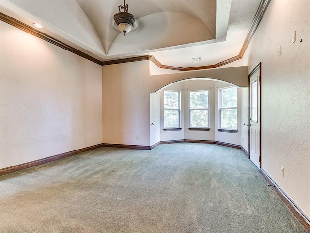 1031 Hidden Valley Ln, Choctaw, OK 73020 - carpeted empty room featuring ceiling fan, crown molding, a textured wall, and a tray ceiling