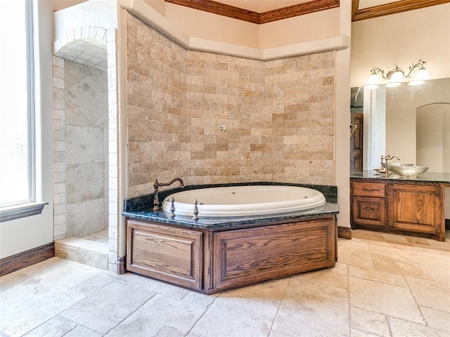 1031 Hidden Valley Ln, Choctaw, OK 73020 - bathroom with a bath, vanity, stone tile flooring, crown molding, and tiled shower
