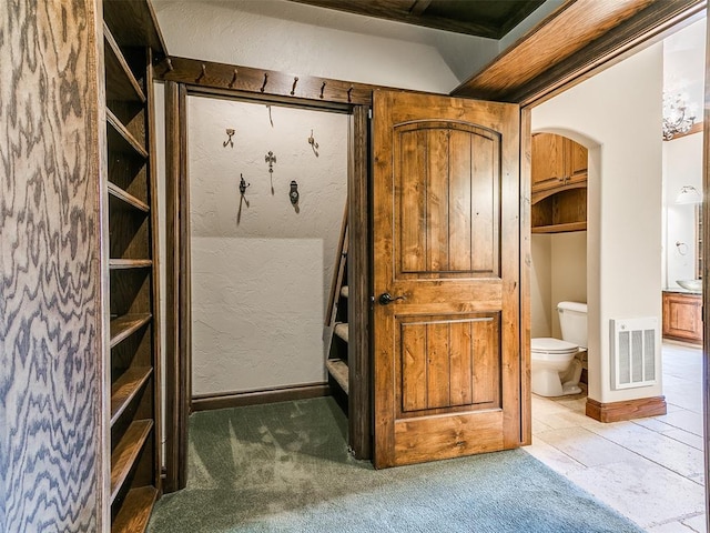 1031 Hidden Valley Ln, Choctaw, OK 73020 - interior space featuring arched walkways and carpet floors