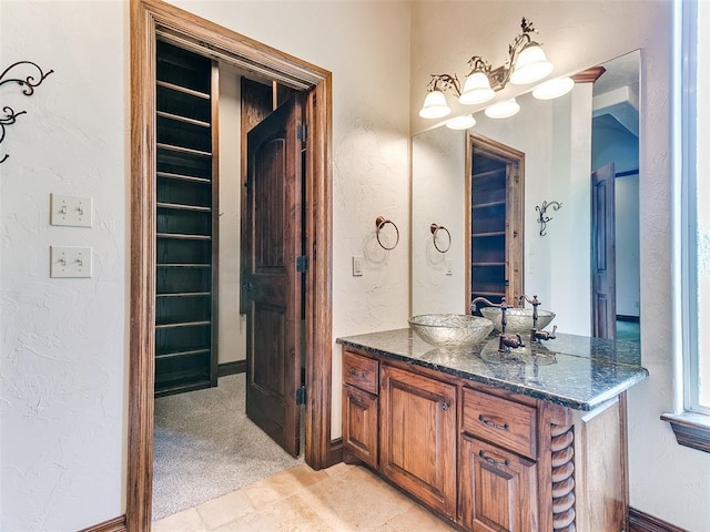 1031 Hidden Valley Ln, Choctaw, OK 73020 - bathroom featuring vanity and a textured wall