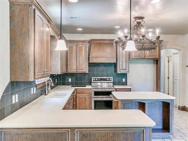 1031 Hidden Valley Ln, Choctaw, OK 73020 - kitchen featuring range with two ovens, custom exhaust hood, backsplash, recessed lighting, and light countertops