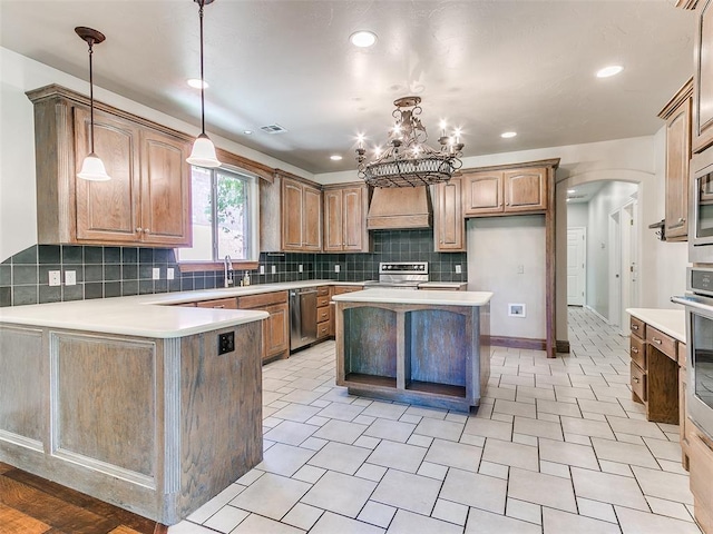 1031 Hidden Valley Ln, Choctaw, OK 73020 - kitchen featuring appliances with stainless steel finishes, premium range hood, arched walkways, decorative backsplash, and light countertops