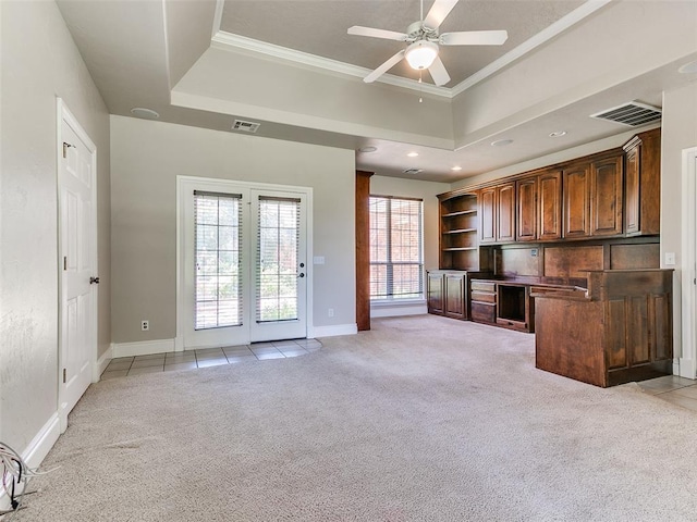 1031 Hidden Valley Ln, Choctaw, OK 73020 - unfurnished living room with light colored carpet, a ceiling fan, a raised ceiling, crown molding, and recessed lighting
