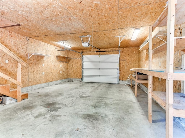 1031 Hidden Valley Ln, Choctaw, OK 73020 - garage with a workshop area and a garage door opener