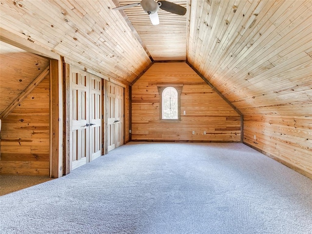 1031 Hidden Valley Ln, Choctaw, OK 73020 - additional living space featuring wood walls, vaulted ceiling, wooden ceiling, a ceiling fan, and carpet flooring