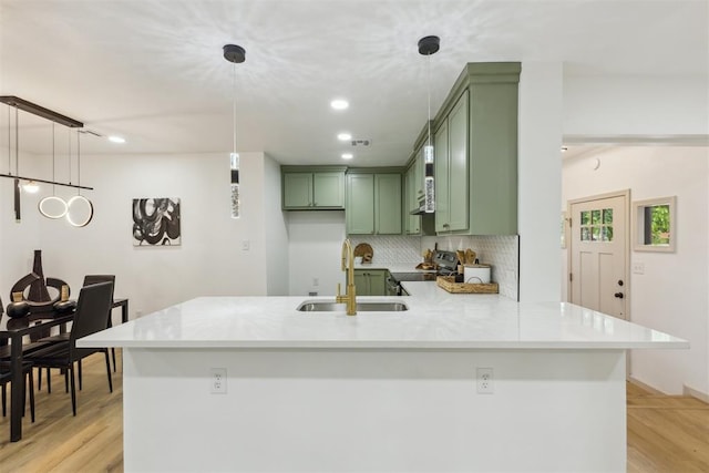 2800 NW 43rd St, Oklahoma City, OK 73112 - kitchen featuring green cabinetry, a sink, electric range, a peninsula, and light countertops