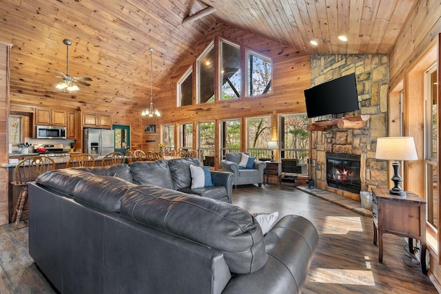 184 Almond Ln, Hochatown, OK 74728 - living room with wooden ceiling, high vaulted ceiling, a fireplace, dark wood-type flooring, and a ceiling fan