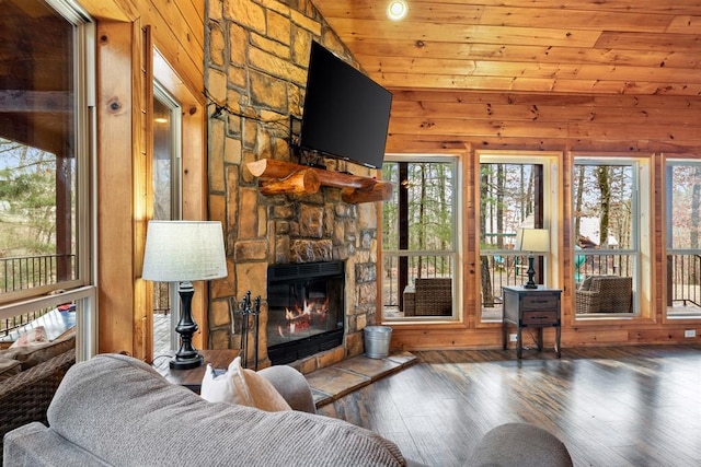 184 Almond Ln, Hochatown, OK 74728 - living room with hardwood / wood-style floors, a fireplace, wood walls, and wood ceiling