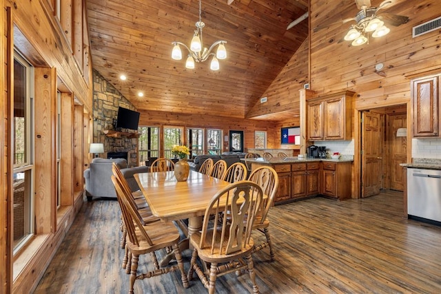 184 Almond Ln, Hochatown, OK 74728 - dining room with dark wood-type flooring, a fireplace, high vaulted ceiling, ceiling fan, and a chandelier
