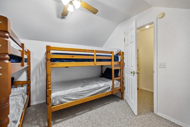 184 Almond Ln, Hochatown, OK 74728 - bedroom with lofted ceiling, carpet flooring, ceiling fan, and baseboards