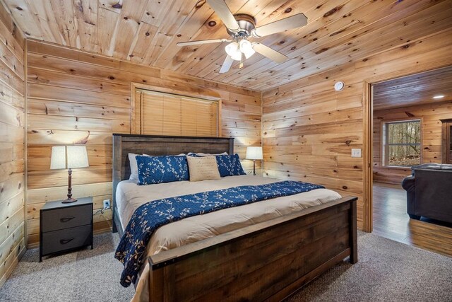 184 Almond Ln, Hochatown, OK 74728 - bedroom with wooden ceiling, wooden walls, carpet flooring, and a ceiling fan