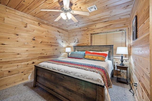 184 Almond Ln, Hochatown, OK 74728 - bedroom featuring wood ceiling, wood walls, carpet floors, and ceiling fan