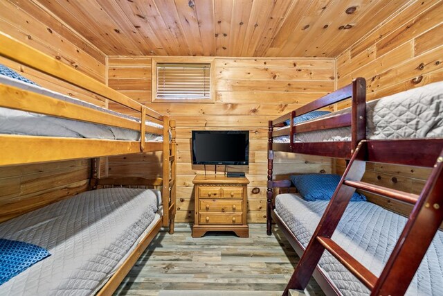 184 Almond Ln, Hochatown, OK 74728 - bedroom featuring wooden walls, wood finished floors, and wooden ceiling
