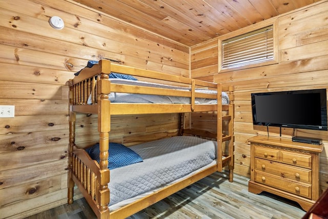 184 Almond Ln, Hochatown, OK 74728 - bedroom with wooden walls, wooden ceiling, and wood finished floors