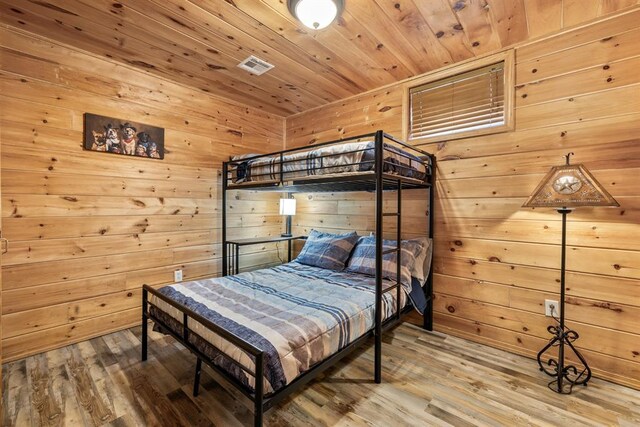 184 Almond Ln, Hochatown, OK 74728 - bedroom featuring wood walls, wood finished floors, and wooden ceiling