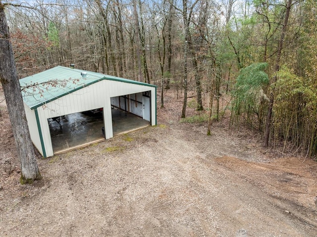 184 Almond Ln, Hochatown, OK 74728 - view of outdoor structure with a forest view and driveway