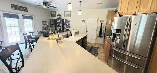 319 W Cedar Ln, Minco, OK 73059 - kitchen featuring stainless steel fridge, a sink, dishwasher, a ceiling fan, and light countertops