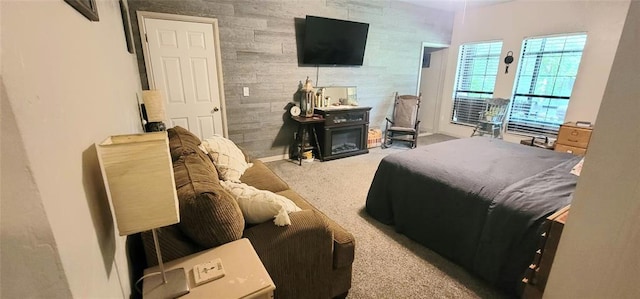 319 W Cedar Ln, Minco, OK 73059 - carpeted bedroom with a glass covered fireplace