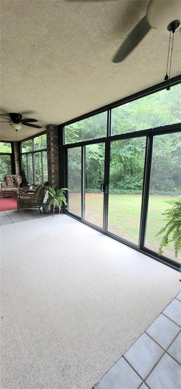 319 W Cedar Ln, Minco, OK 73059 - unfurnished sunroom featuring plenty of natural light