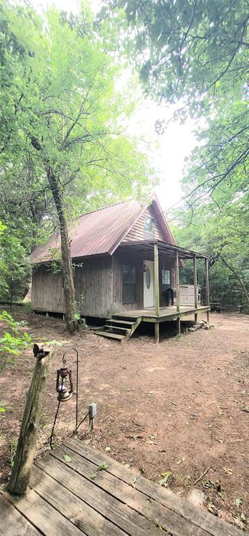 319 W Cedar Ln, Minco, OK 73059 - rear view of house featuring metal roof and a wooden deck