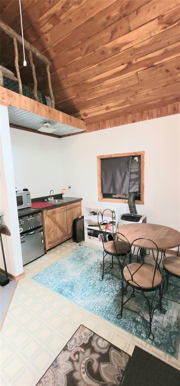 319 W Cedar Ln, Minco, OK 73059 - interior space with wooden ceiling and bar area