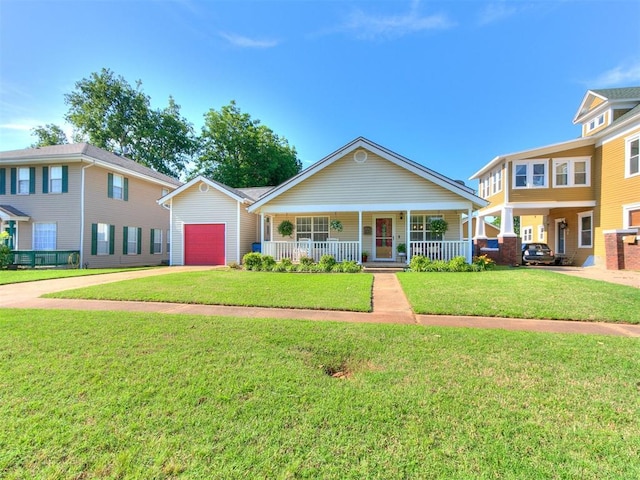 913 E Harrison Ave, Guthrie, OK 73044 - view of front facade with covered porch, an attached garage, driveway, and a front yard