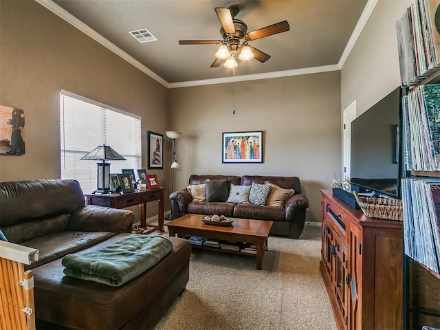 913 E Harrison Ave, Guthrie, OK 73044 - carpeted living room featuring ceiling fan and crown molding
