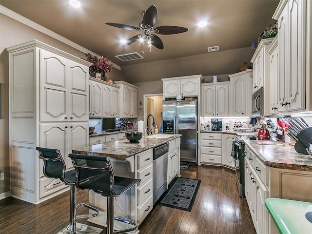 913 E Harrison Ave, Guthrie, OK 73044 - kitchen with appliances with stainless steel finishes, ceiling fan, decorative backsplash, a sink, and lofted ceiling
