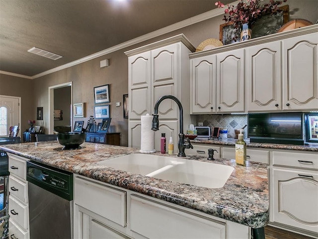913 E Harrison Ave, Guthrie, OK 73044 - kitchen featuring dishwasher, a sink, crown molding, tasteful backsplash, and stone countertops