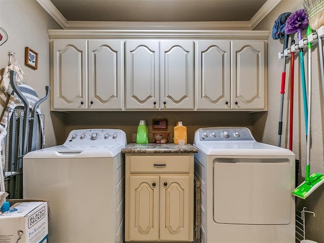 913 E Harrison Ave, Guthrie, OK 73044 - laundry room with washer and dryer, cabinet space, and ornamental molding