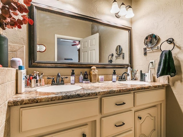 913 E Harrison Ave, Guthrie, OK 73044 - bathroom with a textured wall and double vanity