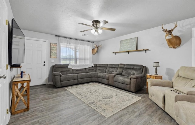109 W 6th St, Amber, OK 73004 - living area featuring wood finished floors and a ceiling fan