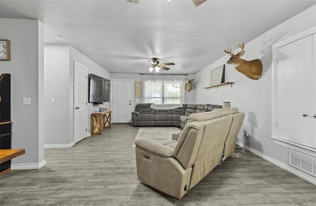 109 W 6th St, Amber, OK 73004 - living area featuring a ceiling fan, baseboards, and wood finished floors