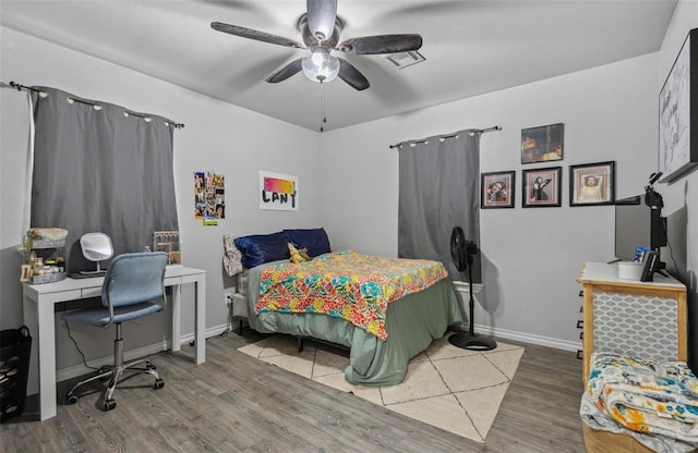 109 W 6th St, Amber, OK 73004 - bedroom with wood finished floors, baseboards, ceiling fan, and an office area