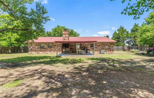 109 W 6th St, Amber, OK 73004 - rear view of property with a chimney, a patio area, metal roof, and cooling unit