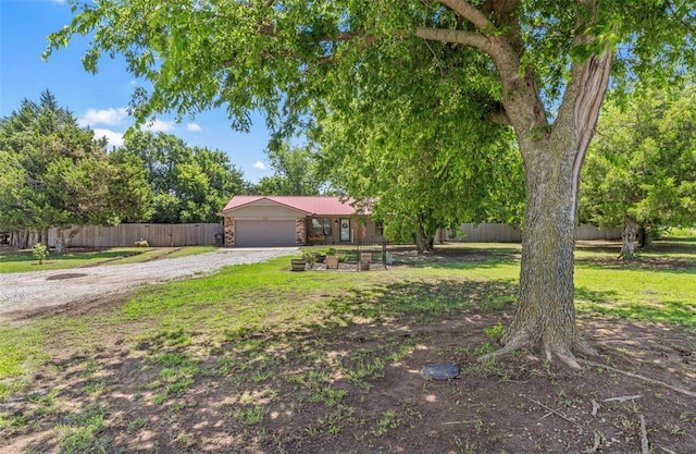 109 W 6th St, Amber, OK 73004 - view of front of house featuring a garage and driveway