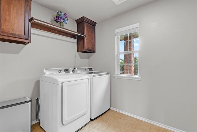 13640 Ridge View Ln, Edmond, OK 73025 - laundry room with washing machine and clothes dryer, cabinet space, and baseboards