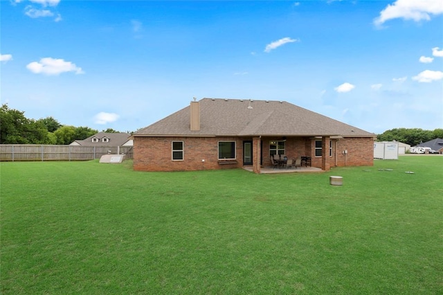 13640 Ridge View Ln, Edmond, OK 73025 - rear view of property with a chimney, a patio, and brick siding
