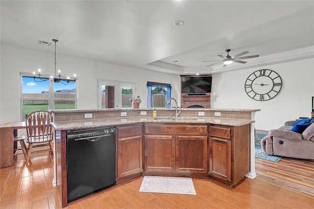 13640 Ridge View Ln, Edmond, OK 73025 - kitchen featuring black dishwasher, open floor plan, a chandelier, ceiling fan, and light wood-style floors