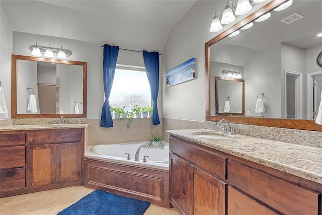 13640 Ridge View Ln, Edmond, OK 73025 - full bathroom with two vanities, tile patterned floors, and a garden tub