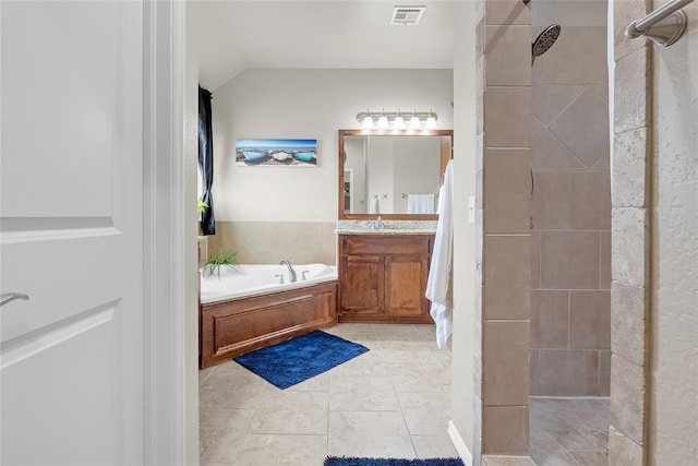 13640 Ridge View Ln, Edmond, OK 73025 - full bath with vanity, a garden tub, tiled shower, vaulted ceiling, and tile patterned flooring