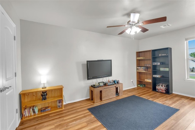 13640 Ridge View Ln, Edmond, OK 73025 - living area with ceiling fan and wood finished floors