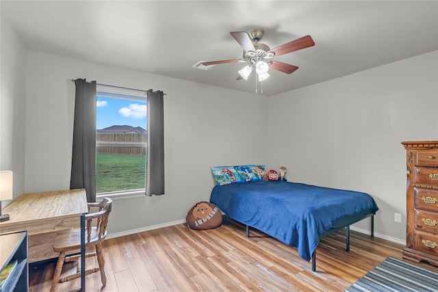 13640 Ridge View Ln, Edmond, OK 73025 - bedroom featuring wood finished floors, an office area, and ceiling fan